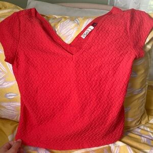 Hot pink crop top short sleeve size large with V neckline.